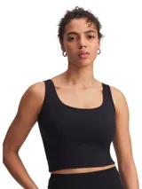 Musculosa deportiva de corte ajustado y largo cropped, con escote redondo tanto en el frente como en la espalda. Confeccionada en tejido de punto cepillado elástico, diseñado para absorber el sudor y brindar libertad de movimiento.