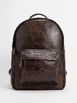 Mochila marrón de cuero, amplia y cómoda, con compartimento principal con cierre, bolsillo frontal con cierre y asas acolchonadas.