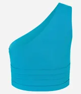 Blusa cropped roja de tejido bengalina, con escote asimétrico de un solo hombro y cierre de cremallera lateral.