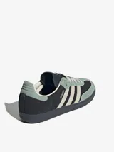 Zapatillas Adidas Samba OG, color negro con detalles en verde agua y beige.