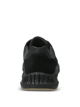 Championes urbanos de cuero negro con detalles en descarne, diseño con suela Spinal de alta amortiguación y base de goma para mayor tracción.
