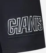 Remera deportiva negra de poliéster con cuello en V, mangas cortas y estampado frontal con el número 25 y el nombre del equipo NFL Giants en blanco.