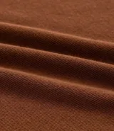 Blusa tipo muscle tee de Ashua, confeccionada en tejido ribana con textura acanalada, cuello redondo y diseño sin mangas.