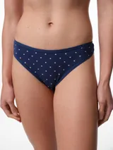 Bombacha tipo colaless de algodón color beige con estampado de pequeños lunares blancos. Presenta un diseño de tiro medio con costuras suaves para mayor comodidad.
