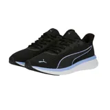 Championes Puma Transport Modern Running color gris, con detalles en blanco y suela blanca.
