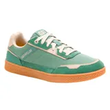 Championes Caterpillar modelo Pause Retro, de diseño urbano con combinación de lona y gamuza en tonos verde y beige. Presenta suela de goma color caramelo con textura hexagonal y cierre mediante cordones.