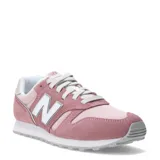 Championes urbanos New Balance modelo 373, color rosado con detalles en blanco y gris. Confeccionados en una combinación de gamuza y malla, presentan el logo 'N' característico en los laterales y una suela de goma resistente.