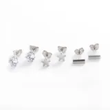 Set de aros mini de acero quirúrgico con forma de corazón, esfera y cruz.