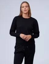 Buzo gris claro de jersey, marca Nanette, con cuello redondo y mangas largas abullonadas con detalle de pinzas en los hombros.