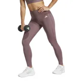 Calza deportiva Adidas Optime Essentials color marrón topo, de tiro alto y largo hasta el tobillo. Presenta el logo de la marca en color blanco en la pierna izquierda y un bolsillo oculto en la cintura.