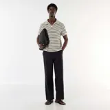 Pantalón de lino mezclado de corte recto y color negro, con bolsillos laterales y cintura elastizada.