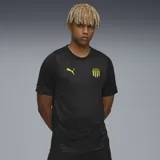 Remera de fútbol Puma del Club Atlético Peñarol, modelo Train. Diseño negro con detalles en amarillo, incluyendo el logo de Puma y el escudo del club.