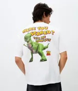 Remera blanca de algodón con cuello redondo y manga corta, con estampa localizada en la espalda del personaje Rex de Toy Story y la frase Were you scared? Tell me honestly.
