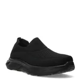 Championes urbanos tipo slip-on de color negro, confeccionados en tejido de punto elástico con suela de goma robusta y diseño ergonómico.