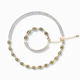 Pulsera dorada con doble diseño: una hilera de cristales claros y una cadena de eslabones originales.