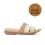 Sandalia plana Usaflex modelo Cecile, de cuero en tonos nude, beige y marfil, con tiras cruzadas y suela baja texturizada.