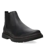 Botas tipo Chelsea de cuero negro con paneles elásticos laterales y suela de goma dentada con plataforma.