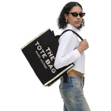 Bolso tipo tote de gran tamaño, confeccionado en lona de algodón y poliéster color negro. Presenta el logo estampado en blanco en el frente y bordes reforzados con detalles de texto. Cuenta con doble asa superior para llevar al hombro.