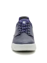Sneaker Caterpillar modelo Hex Lite, color azul, confeccionada en cuero con detalles textiles. Presenta suela de EVA blanca con diseño hexagonal, cierre mediante cordones y logo de la marca en el lateral.