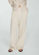 Pantalon wideleg de tiro alto, confeccionado en tejido de bambula de algodón. Presenta cintura elástica y bolsillos laterales.