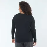Camiseta de punto negra con cuello en V y mangas largas, de corte recto y holgado.