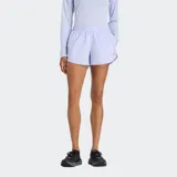 Short deportivo New Balance de secado rápido con tecnología NB DRY, cintura elástica con cordón ajustable y short interior integrado. Presenta un diseño minimalista en color lila con logo reflectante en el lateral.