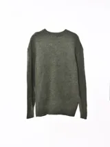 Sweater azul jaspeado de tejido de punto con cuello redondo y mangas largas.