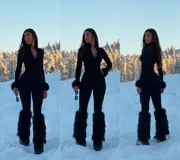 Catsuit negro de manga larga con ajuste al cuerpo tipo segunda piel. Presenta un cierre frontal central que permite regular la profundidad del escote y un diseño de pierna larga y ajustada.