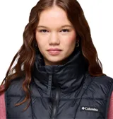 Chaleco acolchado Columbia de color negro con cuello alto, cierre frontal y bolsillos laterales con cremallera. Cuenta con tecnología térmica reflectante Omni-Heat y aislamiento sintético reciclado.