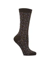 Medias de largo medio color marrón con estampado de pequeñas flores en tonos rosados y celestes. Cuentan con puño suave para mayor comodidad.