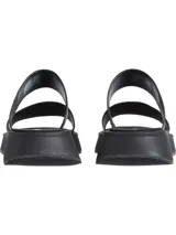 Sandalias tipo slide Calvin Klein de cuero negro con doble tira y plataforma.