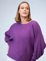 Buzo marca Cupio de tejido acanalado color azul. Tiene mangas largas estilo dolman y aplique de botones en la espalda.