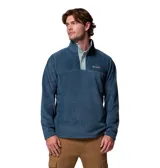 Buzo polar de la marca Columbia, modelo Steens Mountain, confeccionado en tejido fleece suave. Presenta cuello alto con cierre de botones a presión, mangas largas y un diseño de calce cómodo ideal para actividades al aire libre.