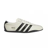 Championes Adidas Tokyo de cuero color crema con detalles en negro, incluyendo las tres tiras laterales y la suela.