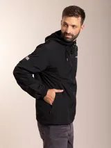 Campera de nylon con capucha, cierre frontal y forro de red. Presenta un diseño minimalista en color beige con detalles en negro.