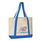 Bolso tipo tote de lona color crema con base y asas en azul eléctrico. Logo de New Balance estampado en el frente en colores celeste, naranja y fucsia.