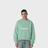 Sweater de tejido de punto en color verde menta, con cuello redondo y diseño de corte holgado. Presenta el logo VNFO estampado en el centro del pecho en color blanco.
