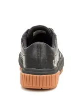Championes Cat modelo Amp para mujer, de color negro con textura punteada, cordones negros y suela de goma marrón con plataforma acanalada.