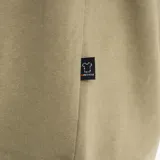 Buzo con capucha Merrell Kaikoura color arena con logo de la marca estampado en el pecho. Confeccionado en algodón reciclado con interior de semi-lana.