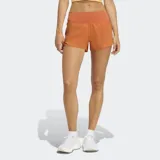 Short deportivo Adidas de tiro medio con cintura elástica ancha, calzoncillo interior de malla y bolsillo trasero con cierre. Presenta tecnología Climacool para mayor frescura y detalles reflectantes.