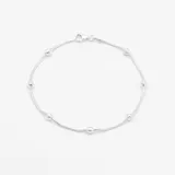 Pulsera de plata 925 compuesta por una cadena de eslabones circulares intercalados con pequeñas esferas satinadas.