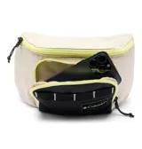 Riñonera Columbia modelo Zigzag II, de diseño bicolor en beige y negro con detalles en amarillo neón. Cuenta con cierre principal, bolsillo frontal con cierre y correa ajustable con hebilla de seguridad.