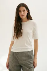 Remera manga 3/4 color celeste.