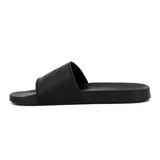 Chanclas negras de goma con tira ancha y logo de Diadora en relieve.