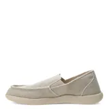 Zapatos tipo slip-on de tela color beige, con diseño de bordes deshilachados y suela de goma al tono.