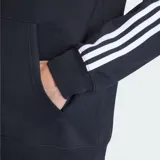 Canguro Adidas con capucha y cordones ajustables, color negro. Presenta las icónicas tres rayas blancas en las mangas y el logo del trébol bordado en el pecho. Incluye bolsillo frontal tipo canguro y puños acanalados.