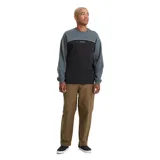 Buzo de cuello redondo Volcom, confeccionado en tejido polar de corte holgado. Diseño en bloques de color verde oscuro y negro, separado por una línea curva contrastante con el logo de la marca bordado en el centro del pecho.
