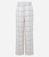 Pantalón de pijama Lov de corte holgado, confeccionado en franela con estampado de cuadros. Presenta cintura elástica y detalle de botones decorativos en la parte frontal.