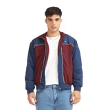 Campera Quiksilver modelo Isla, con diseño de bloques de color en azul y bordó, cierre frontal completo, cuello alto y puños elásticos.
