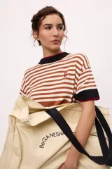 Bolso tote de algodón color crema con asas negras y el logo "BeGANESHA" estampado en negro. Incluye un bolsillo interno con cierre y un porta termo.